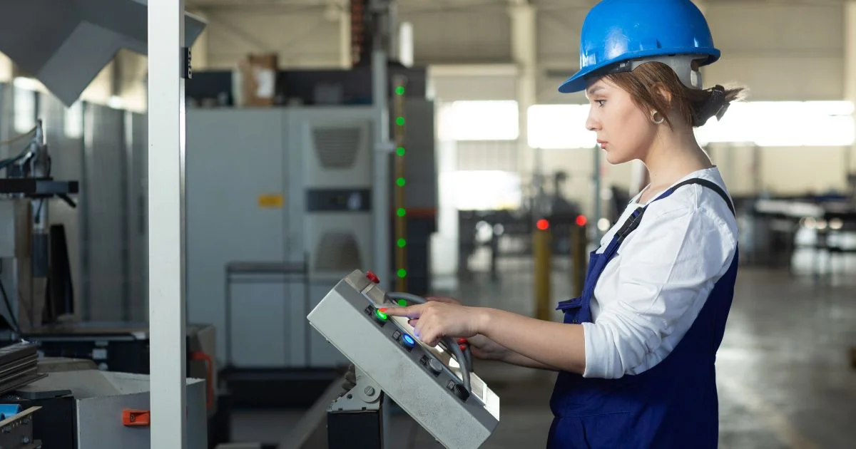 Factory operator using machine control panel